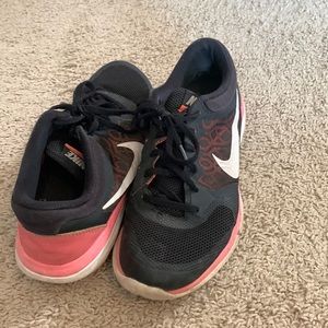 Coral and black Nike shoes